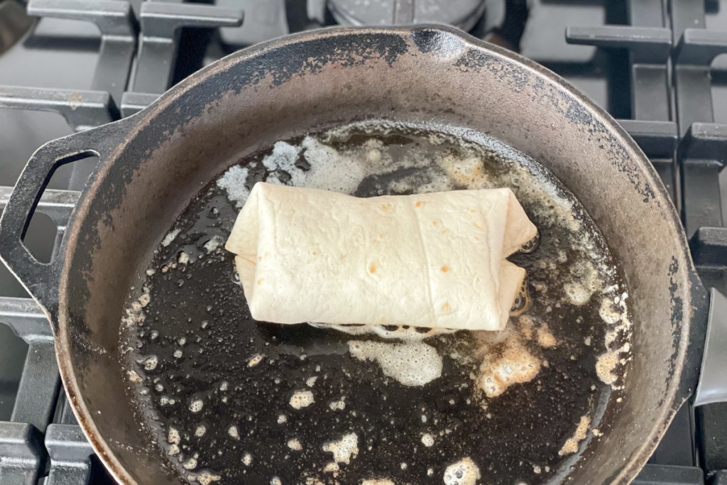 browning a burrito in a skillet
