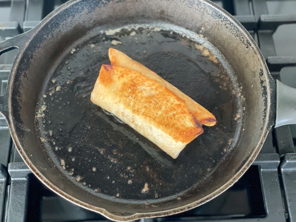 browning a burrito in a skillet