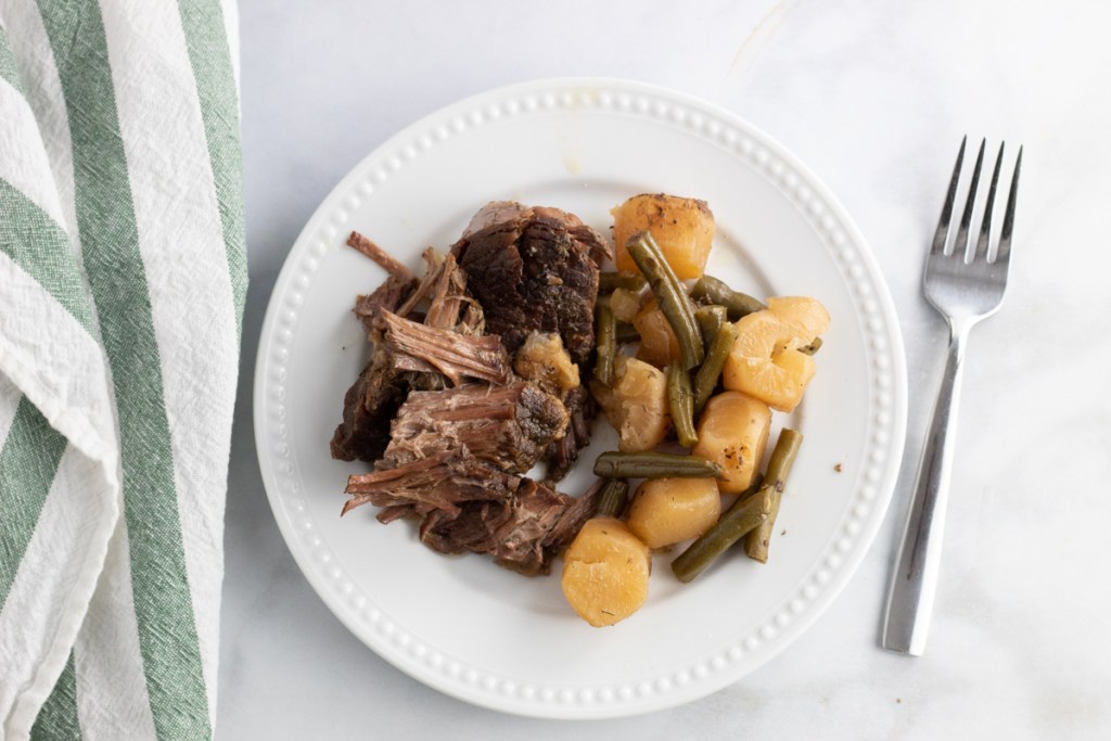 plate of pot roast with radish and green beans 
