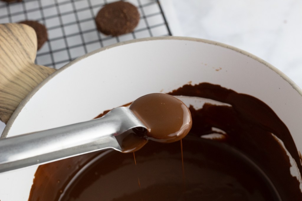 dipping wafers into melted chocolate