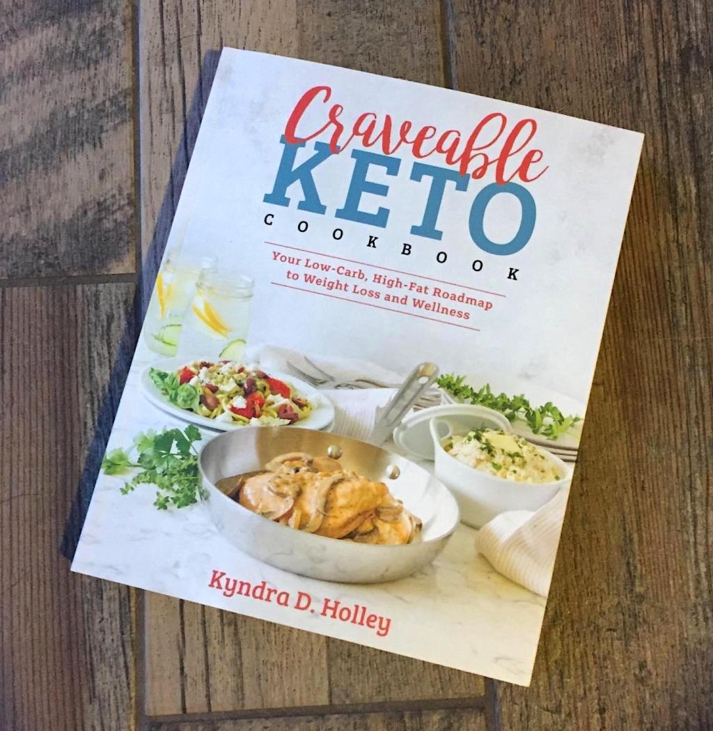 Craveable keto cookbook on wood floor 