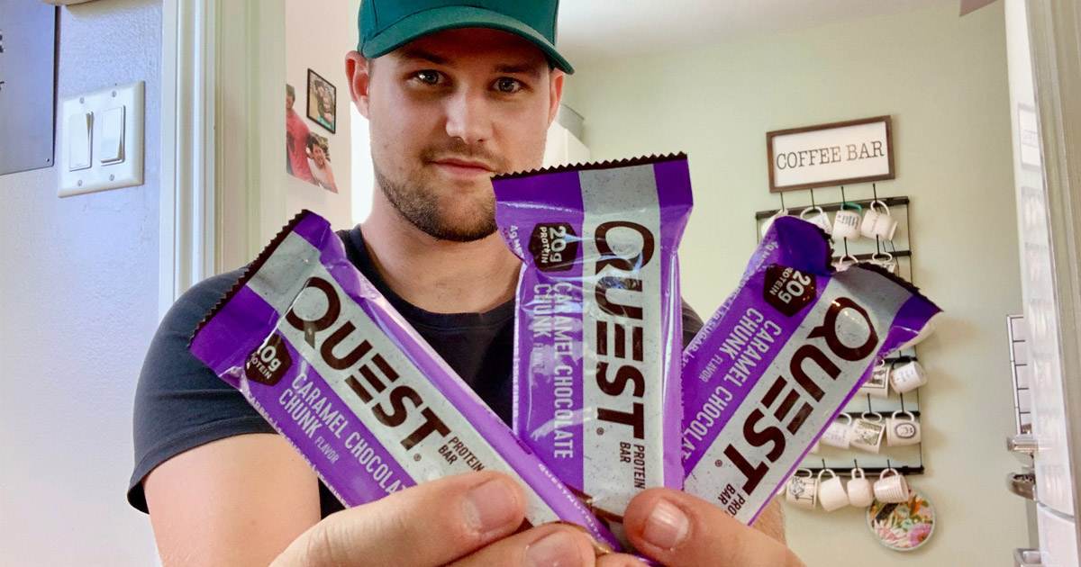 man holding Quest bars