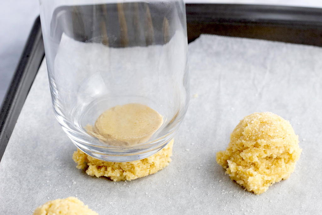 press sugar cookies down with cup 