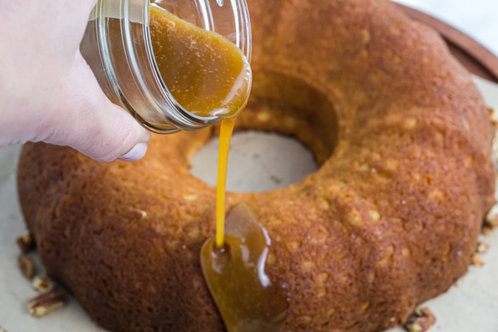 pouring caramel on cake 