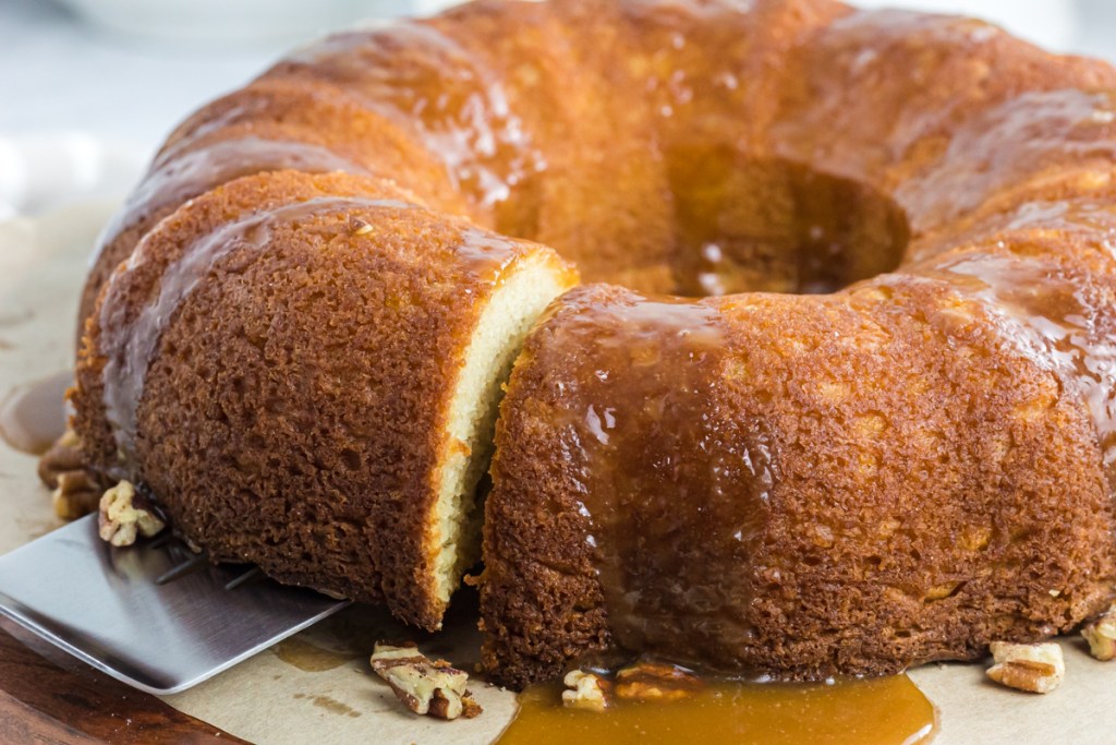 slice being pulled from cake stand