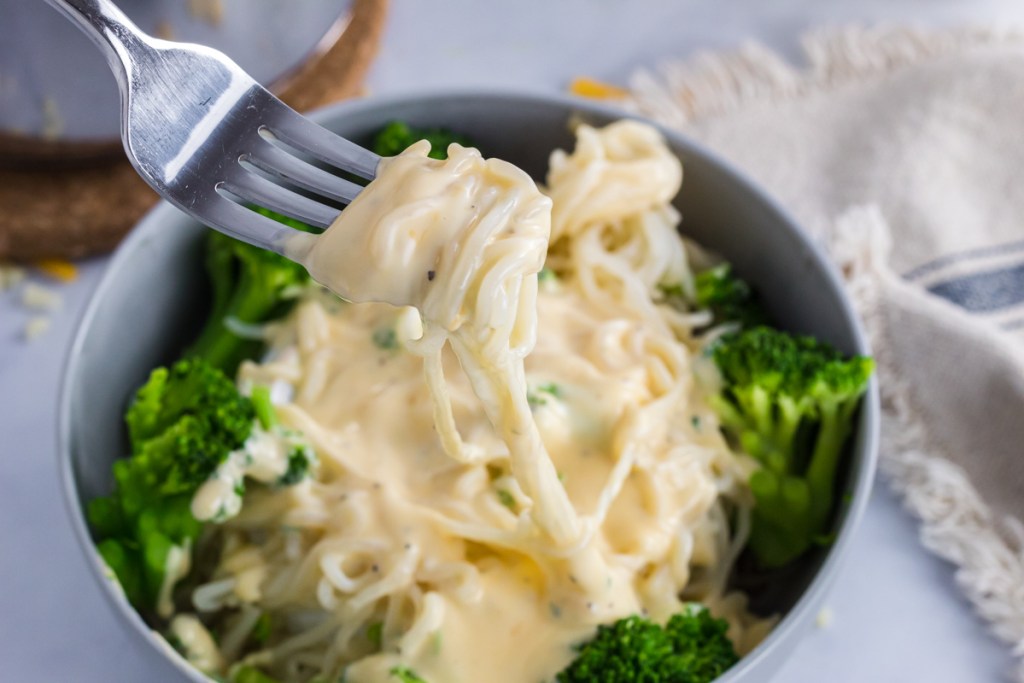 fork with keto cheese sauce and hearts of palm pasta