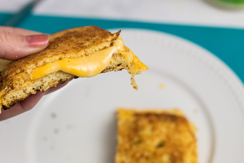 holding keto grilled cheese sandwich
