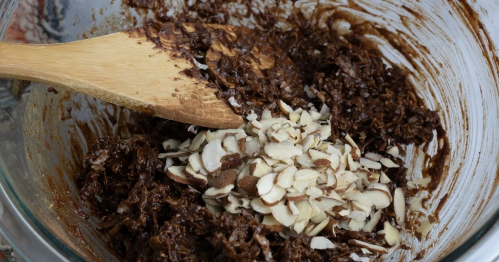 mixing together keto no-bake chocolate and coconut cookies 