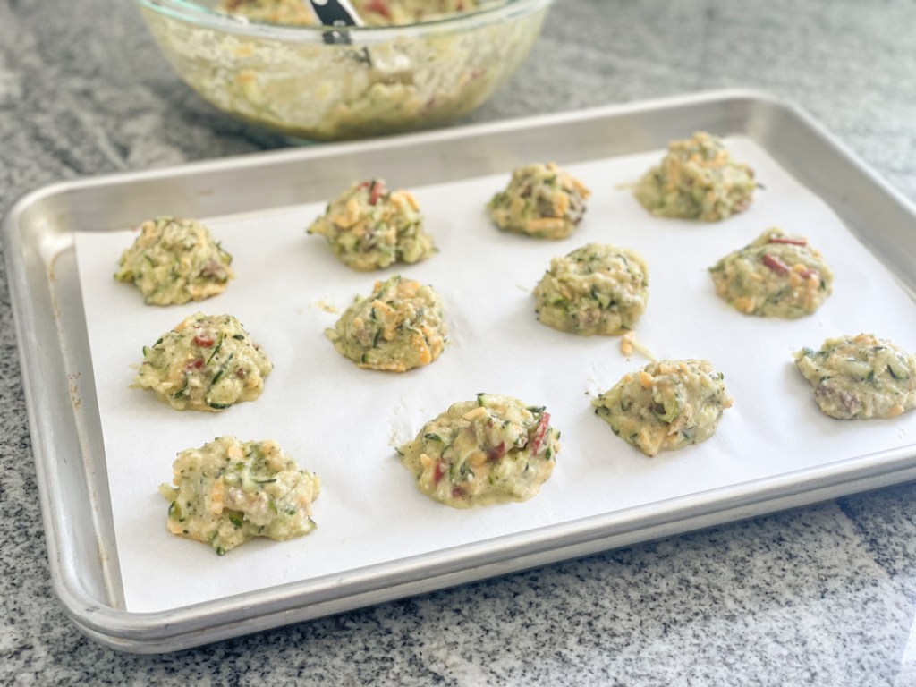 zucchini pizza bites raw on baking sheet