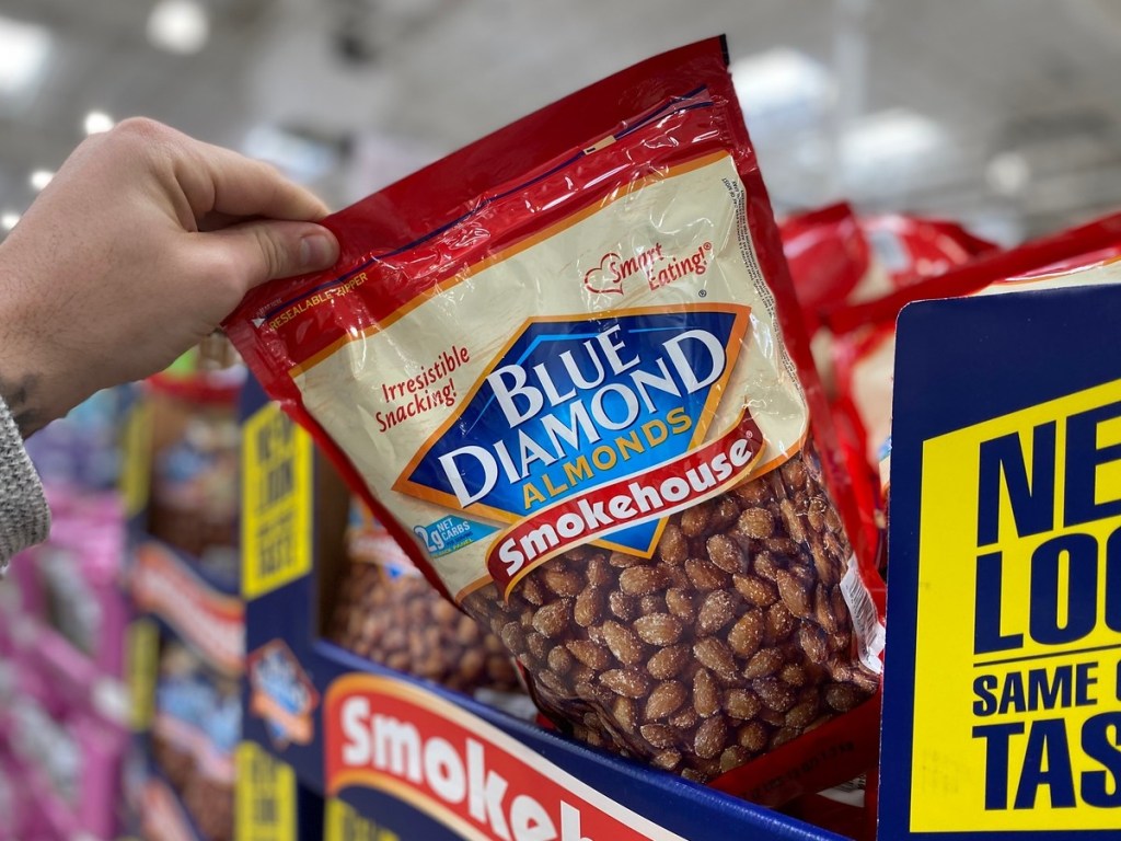 removing bag of Almonds from display at Costco