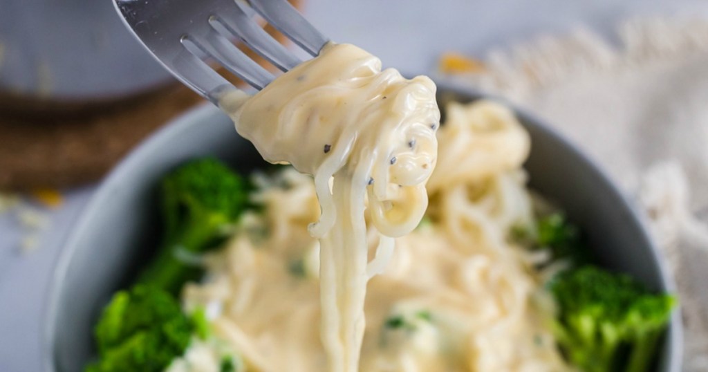 up close fork with keto pasta and cheese sauce 