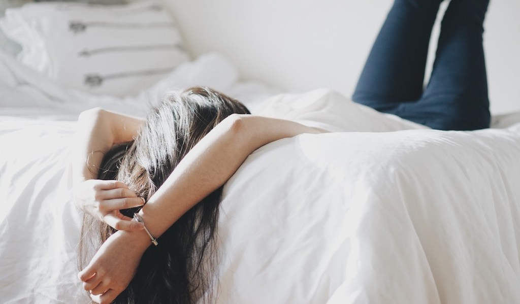 woman relaxing on a bed