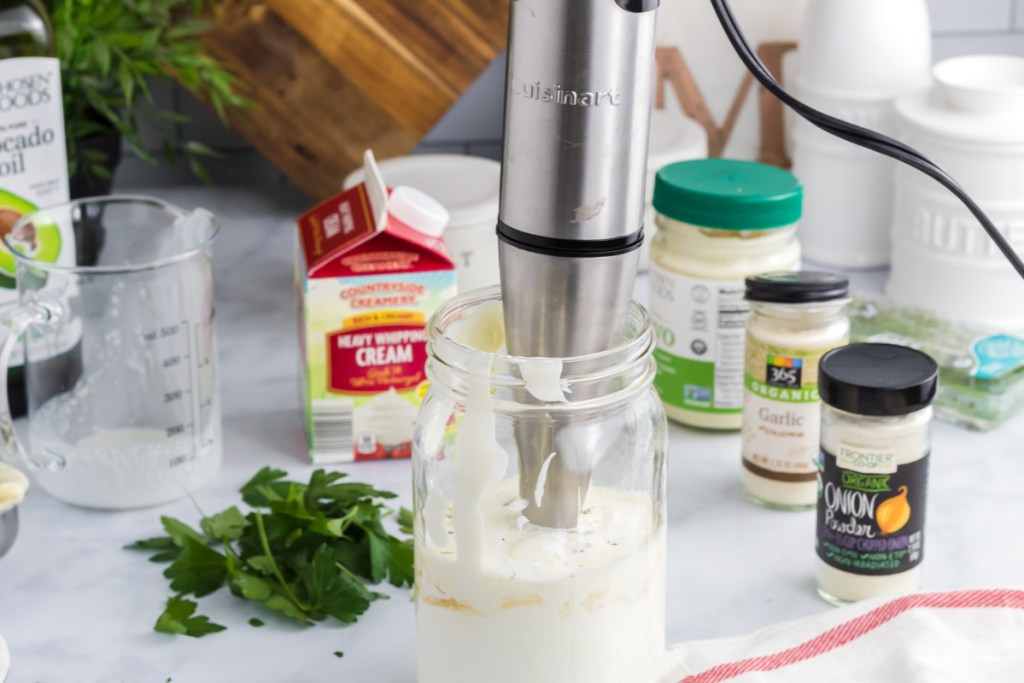 blending the keto ranch dressing in mason jar