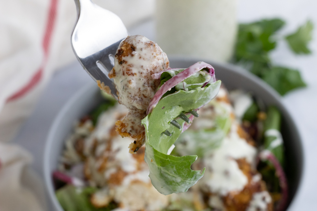 salad and chicken on fork with keto ranch dressing 