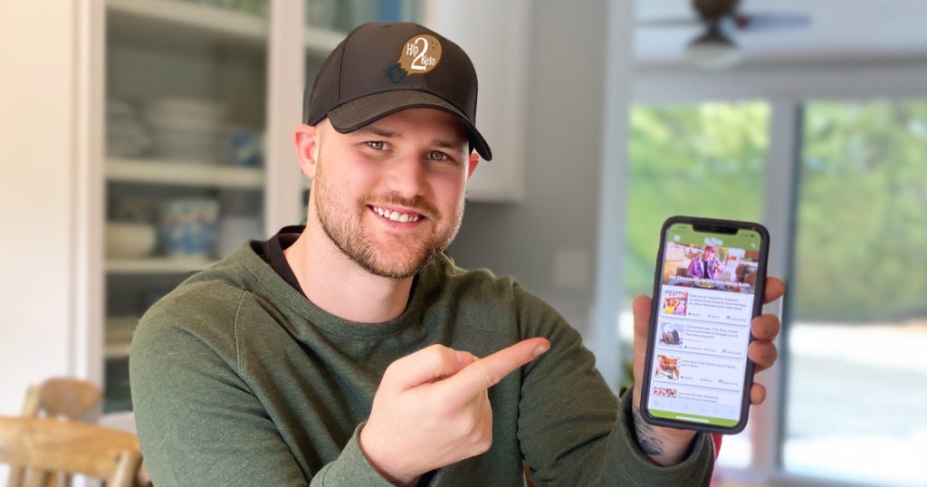 man holding phone with hip2keto app