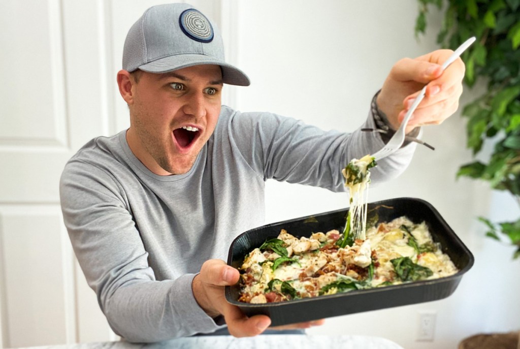 man holding pizza bowl