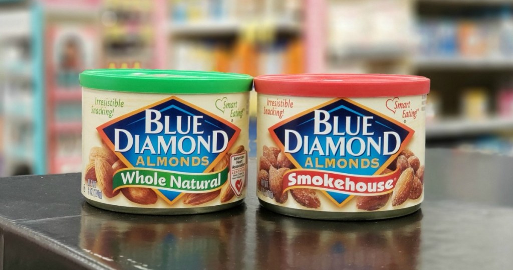 2 small cans of blue diamond almonds sitting on store shelf