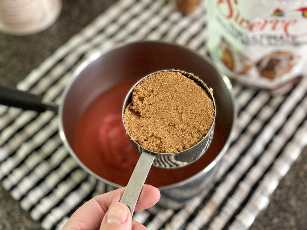 adding keto brown sweetener to a saucepan