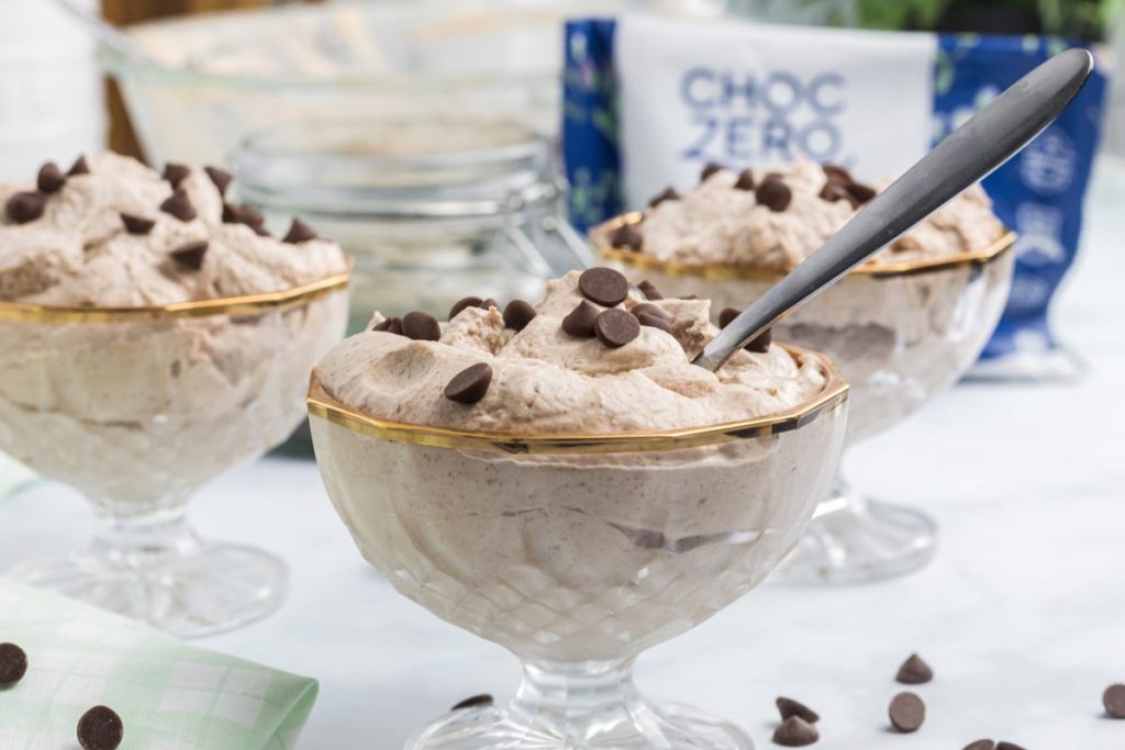 keto chocolate mousse in bowls with chocolate chips on top