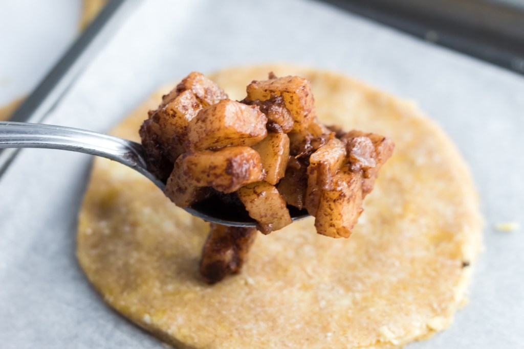 putting filling into pie crust