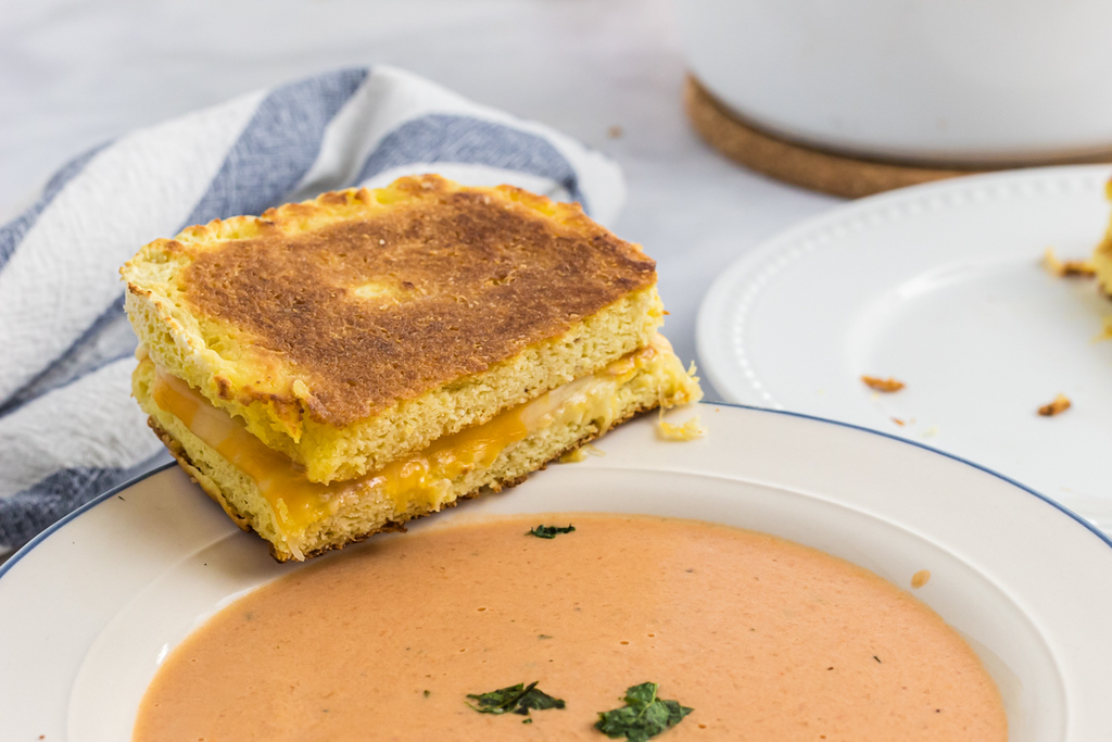 keto grilled cheese sandwich with bowl of tomato soup