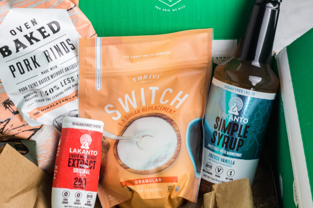 keto groceries, pork rinds, and sugar alternatives next to thrive market box