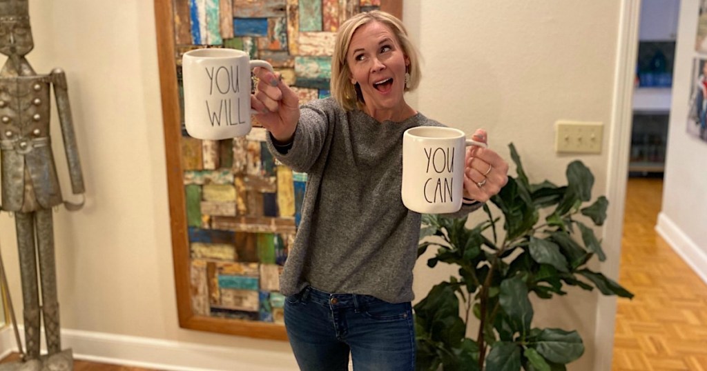 woman holding You Will and You Can coffee mugs 