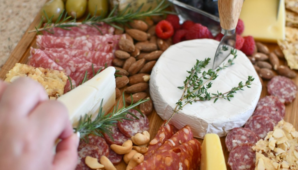 adding fresh herbs to charcuterie