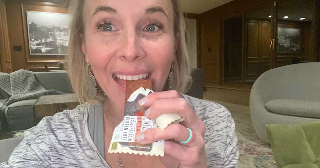 woman eating Epic protein bar