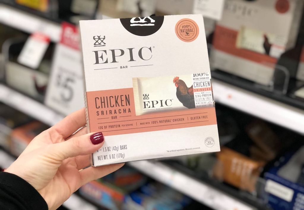 hand holding a box of epic chicken sriracha protein bars in store