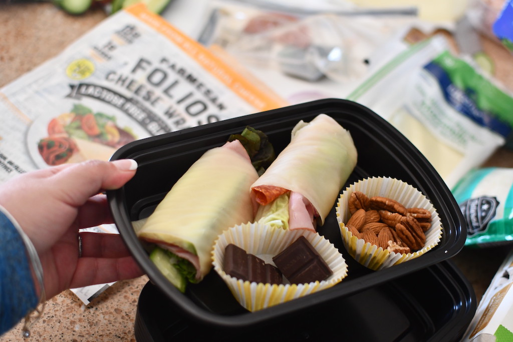 keto cheese wraps with nuts in meal prep container 
