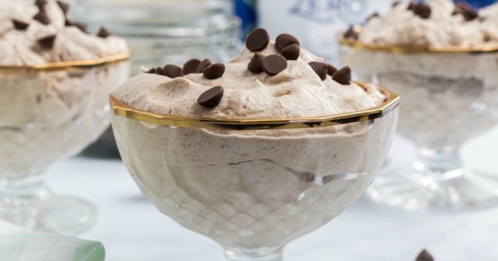 keto chocolate mousse served in glass dish with chocolate chips 