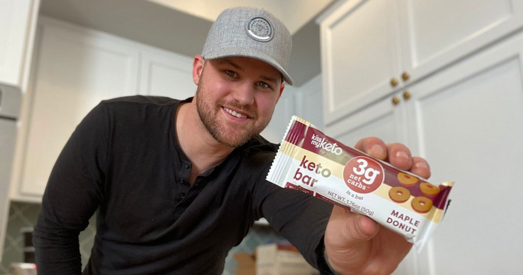 man holding kiss my keto bar