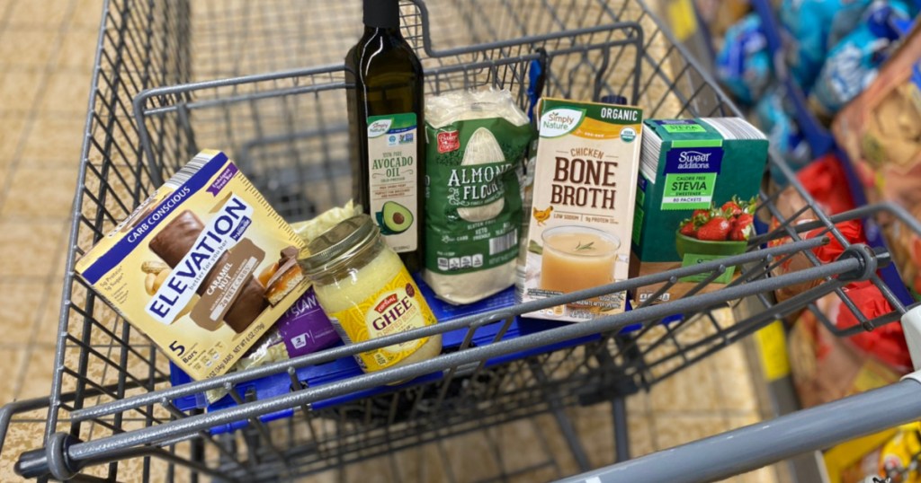 olive oil, bone broth, and other keto groceries in shopping cart basket