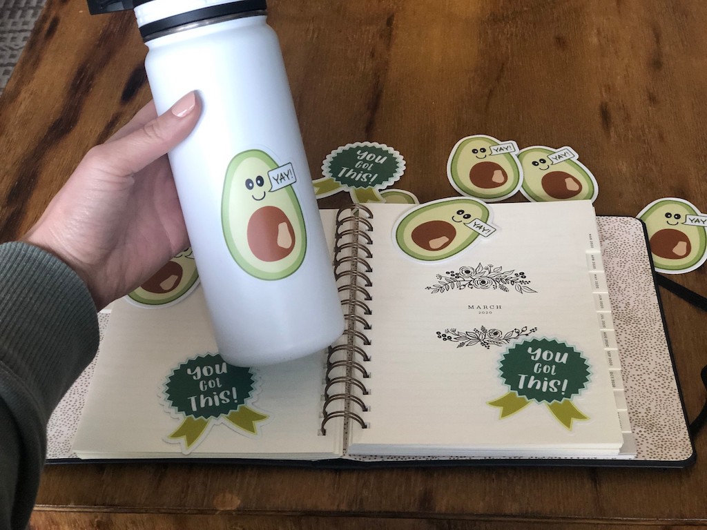 motivational keto stickers on journal and water bottle 