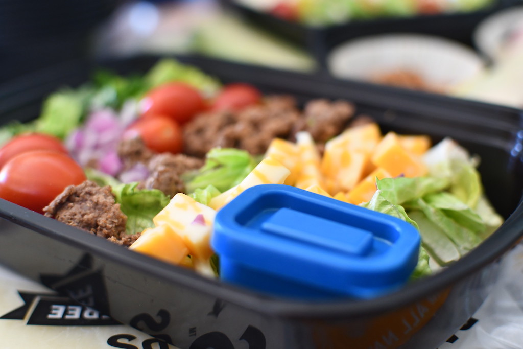 close up of keto taco salad in meal prep container