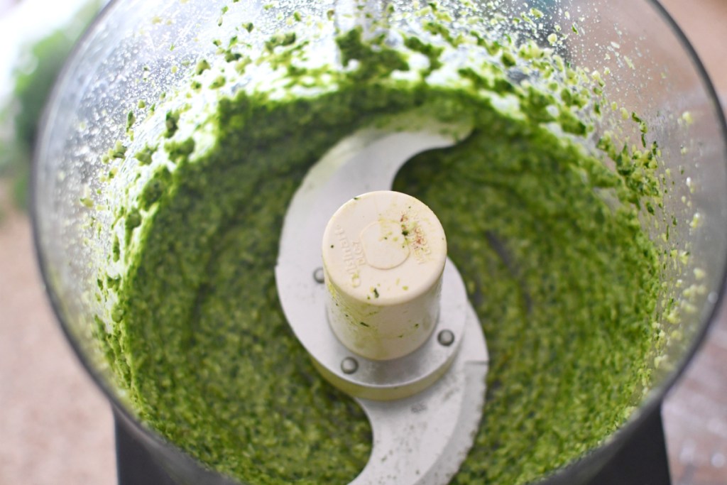 making cilantro lime pesto in a food processor