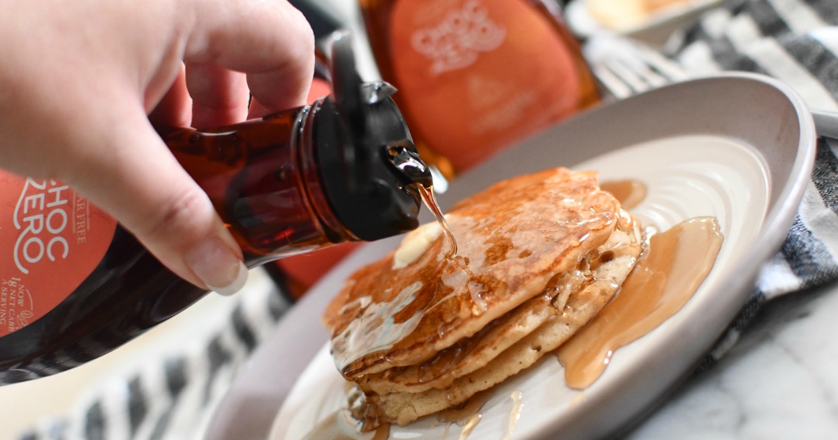 putting syrup on pancakes 