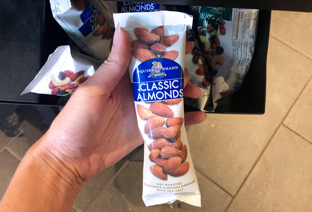 hand holding bag of almonds at starbucks