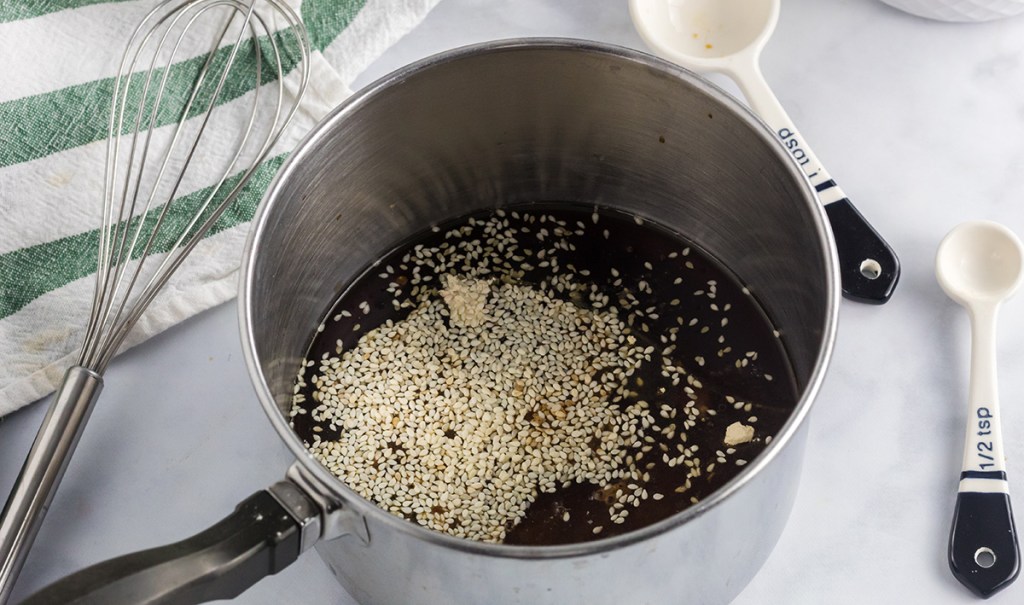 sesame seeds in sauce pan for keto stir fry sauce 