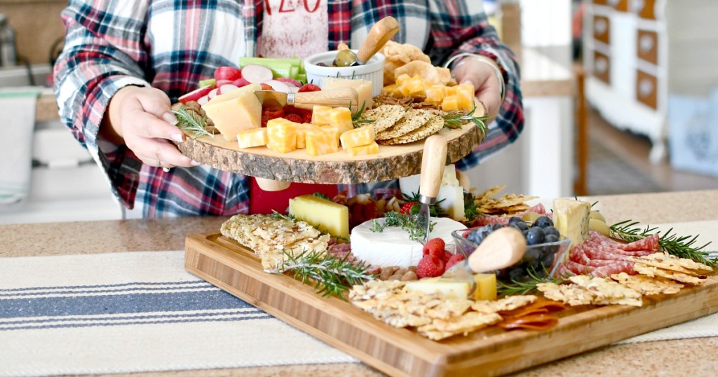 holding up keto charcuterie board