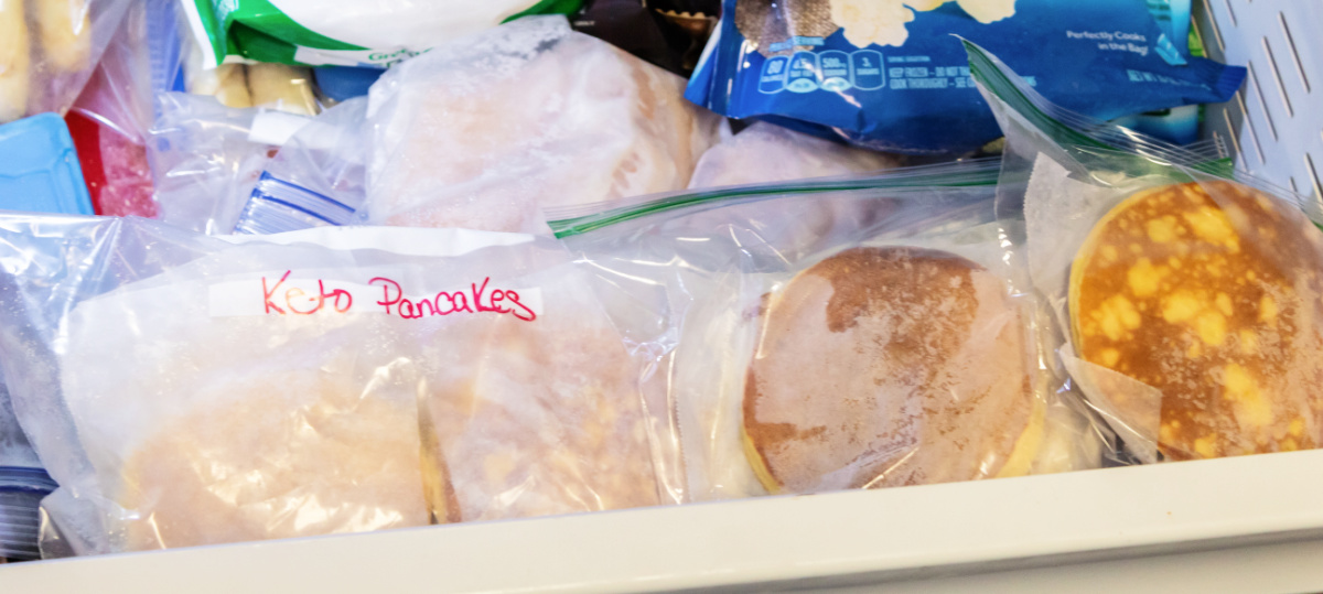 bags of frozen breakfast food in a freezer