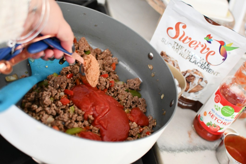 Adding Swerve and low sugar ketchup to keto sloppy joes.