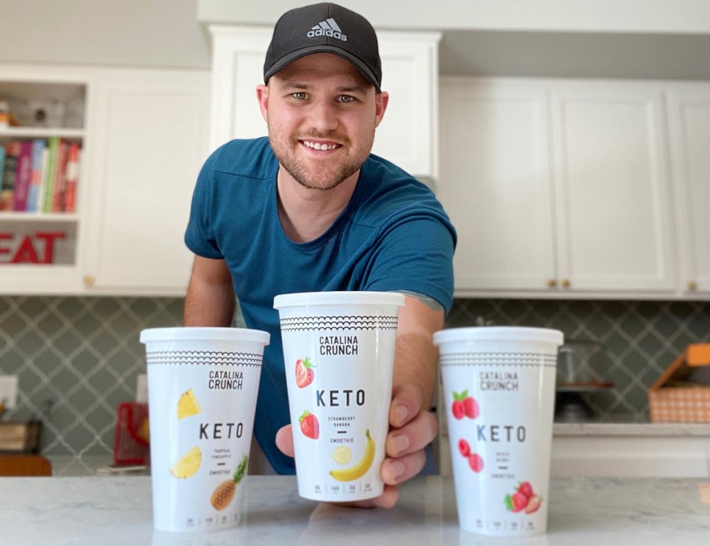 man holding catalina crunch keto smoothies