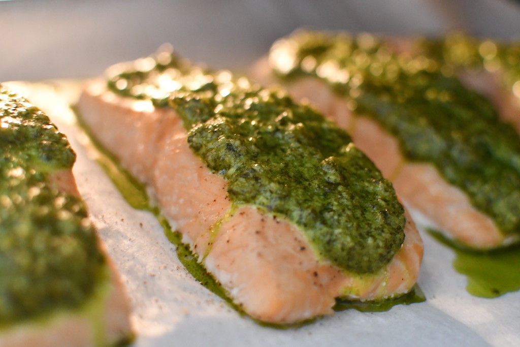 cilantro pesto salmon on parchment paper