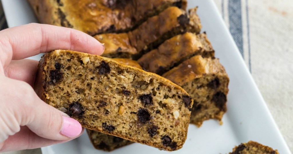 holding slice of keto chocolate chip bread 