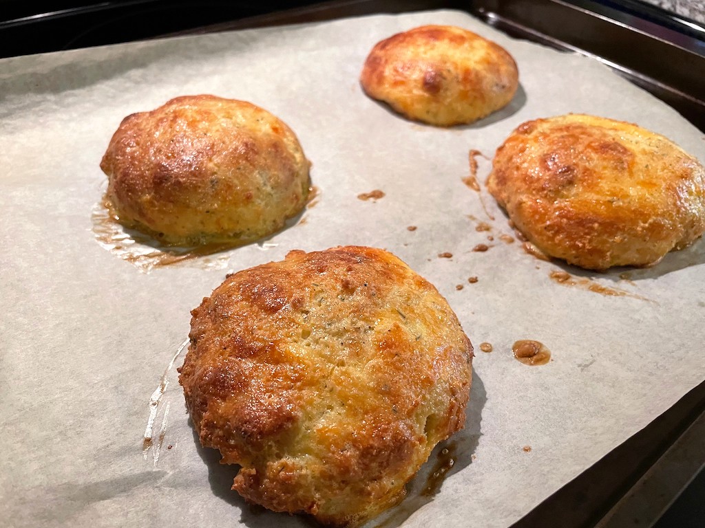 baked keto buns on parchment-lined sheet pan 