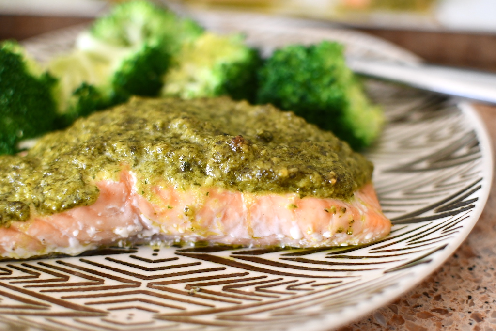 keto cilantro pesto salmon on plate with broccoli