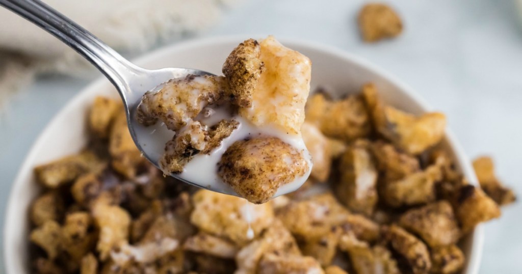 spoon of keto cinnamon toast crunch cereal with almond milk