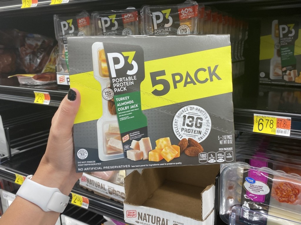 holding P3 protein pack at Walmart